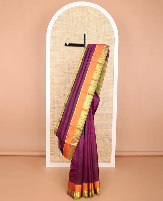 Purple striped kancheepuram silk saree with contrast border of thilakam mokku, yanaai design & zari design pallu