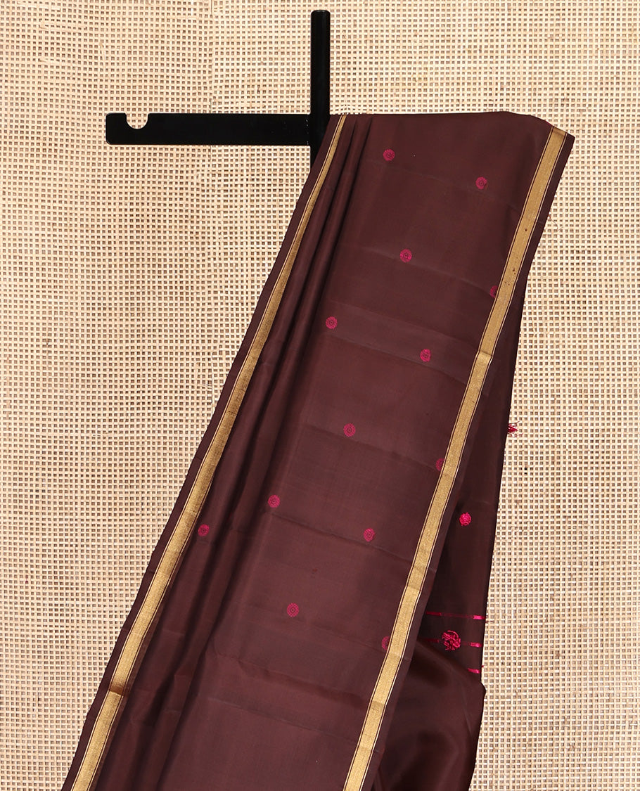 Brown Mayuri Soft Silk Saree, Subtly Woven with Buttas All Over Its Body, a Subtle Zari Piping Border, Pallu Steeped with Buttas, and Paired with a Matching Blouse