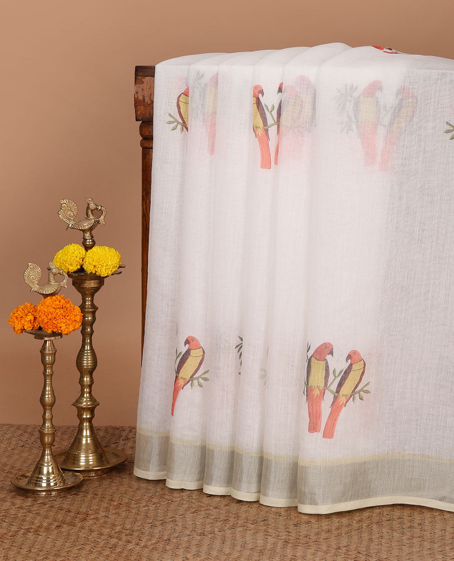 White digital printed linen cotton saree with parrots on the tree design, contrast bavanji border & parrot printed pallu