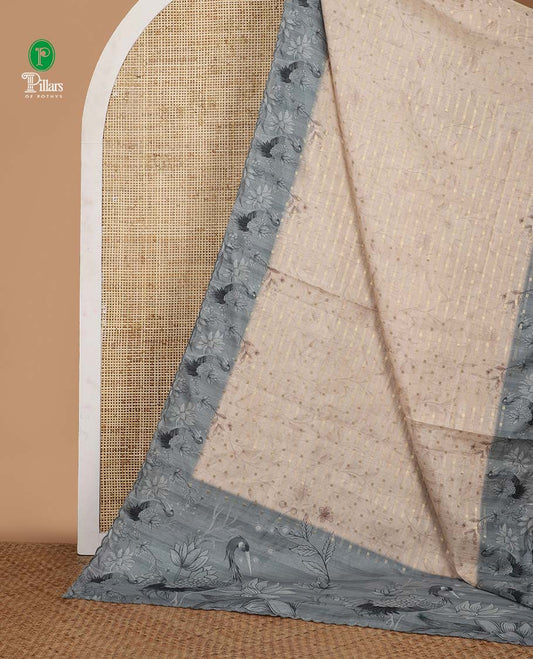 Cream leaf vine digital printed and 1000 dobby-style buttas woven semi-tussar saree, contrast blue scallop border & pallu of floral & bird motifs print