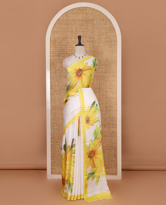 Cream base digital printed satin crepe saree with big yellow floral motifs all over the saree, plain yellow border & blouse