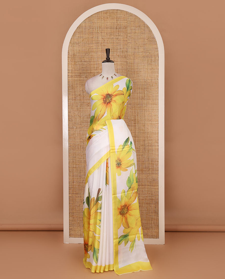 Cream base digital printed satin crepe saree with big yellow floral motifs all over the saree, plain yellow border & blouse