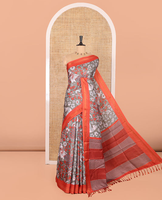 Sage Green Manipuri Silk Saree, Accentuated with Kalamkari-Style Floral Vine and Peacock Motifs Printed All Over Its Body, Complemented by a Contrast Zari Border, Pallu of Chevron Stripes, and Paired with a Contrast Blouse