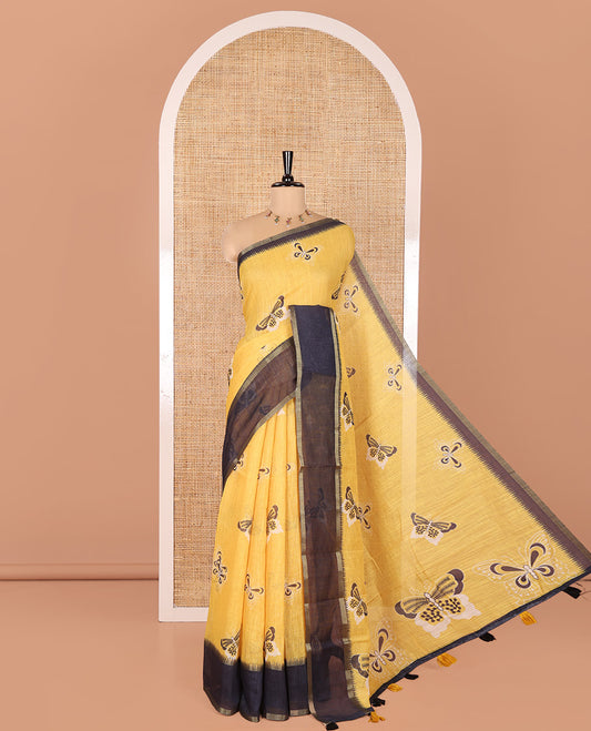 Yellow Linen Cotton Saree, Beautified with Butterfly Motifs Printed On Its Body, Complemented by Temple Border, Pallu Steeped with Butterflies, and Paired with a Contrast Blouse