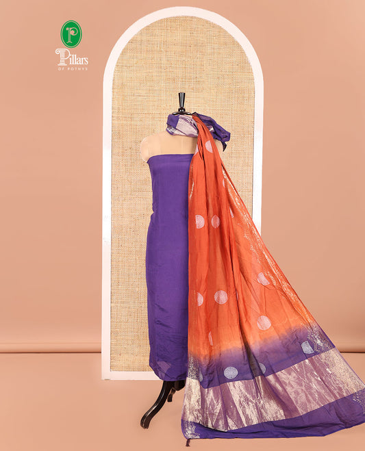 Dark Purple Semi Silk Material Churidar Set, Subtly Made Plain Top, a Plain Santoon Bottom, and Is Paired with a Dual-Colored Bandhani Motifs Semi Silk Dupatta