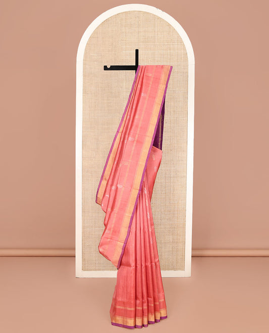 Peach Uppada Silk Saree, Enthralled with Zari Buttas on Its Body, Subtly Sparkled Zari Border, Complemented by a Contrast Pallu Depicting Intricate Design Weave, and Paired with a Contrast Blouse