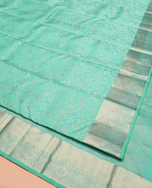 Blue Kanchipuram Silk Saree Bedecked with Floral Jaal Jacquard Design, Highlighted by Zari Border, Pallu Subtly Woven in Jaal Designs, and Paired with a Matching Blouse