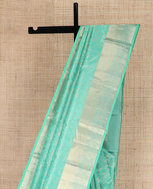 Blue Kanchipuram Silk Saree Bedecked with Floral Jaal Jacquard Design, Highlighted by Zari Border, Pallu Subtly Woven in Jaal Designs, and Paired with a Matching Blouse