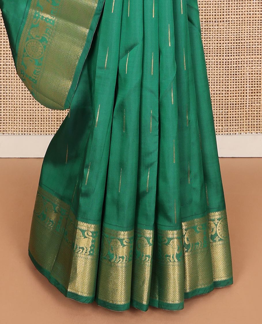 Dark Green malli mokku zari buttas Vasundhara silk mix saree, zari border of rekku, rudraksham, yaali , chakram & mayil kann & intricate pallu