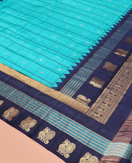 Blue Vasundhara Silk Saree, Mesmerized with Zari Butta Enclosed Checked Design on Its Body, Highlighted by a Contrast Border of Thazampoo Rekku, Banaras, and Mayil Designs, Scintillating Pallu of Jaal Design, and Paired with a Contrast Blouse