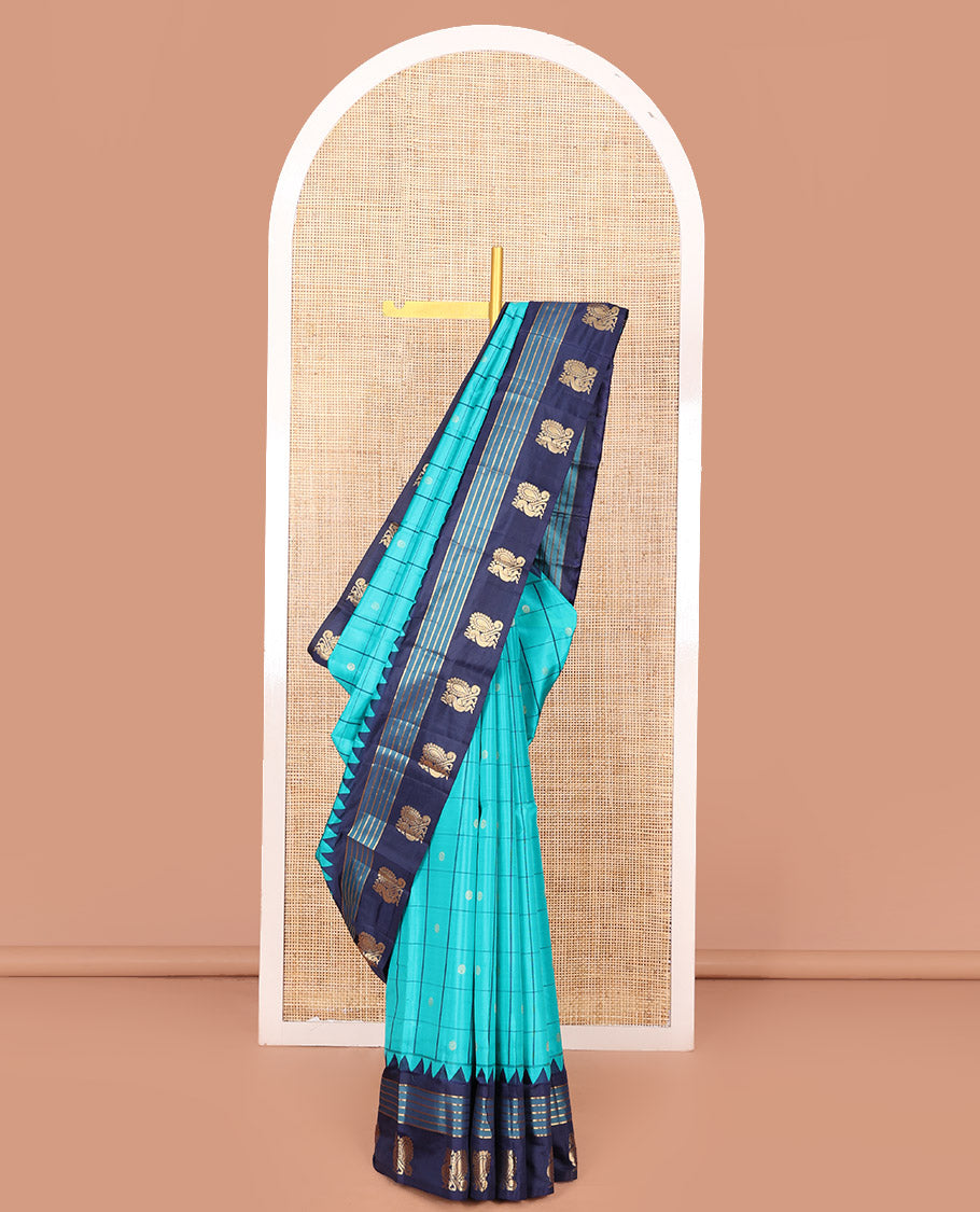 Blue Vasundhara Silk Saree, Mesmerized with Zari Butta Enclosed Checked Design on Its Body, Highlighted by a Contrast Border of Thazampoo Rekku, Banaras, and Mayil Designs, Scintillating Pallu of Jaal Design, and Paired with a Contrast Blouse