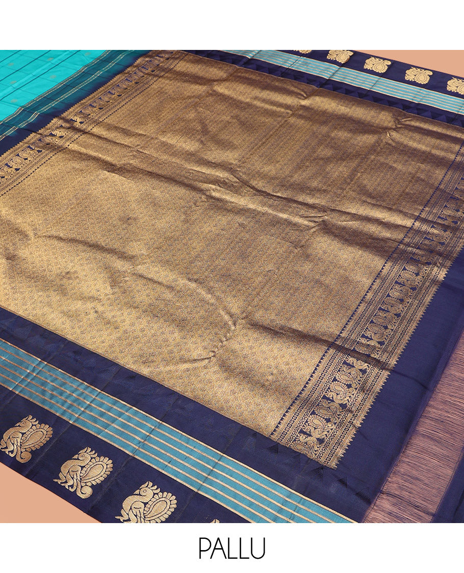 Blue Vasundhara Silk Saree, Mesmerized with Zari Butta Enclosed Checked Design on Its Body, Highlighted by a Contrast Border of Thazampoo Rekku, Banaras, and Mayil Designs, Scintillating Pallu of Jaal Design, and Paired with a Contrast Blouse