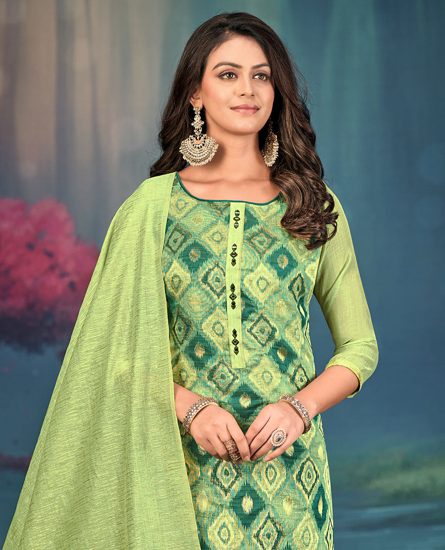 Green churidar material set, diamond patterned and mirror embroidered top, contrast plain bottom, and geometric patterned dupatta