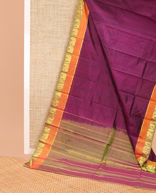 Purple striped kancheepuram silk saree with contrast border of thilakam mokku, yanaai design & zari design pallu