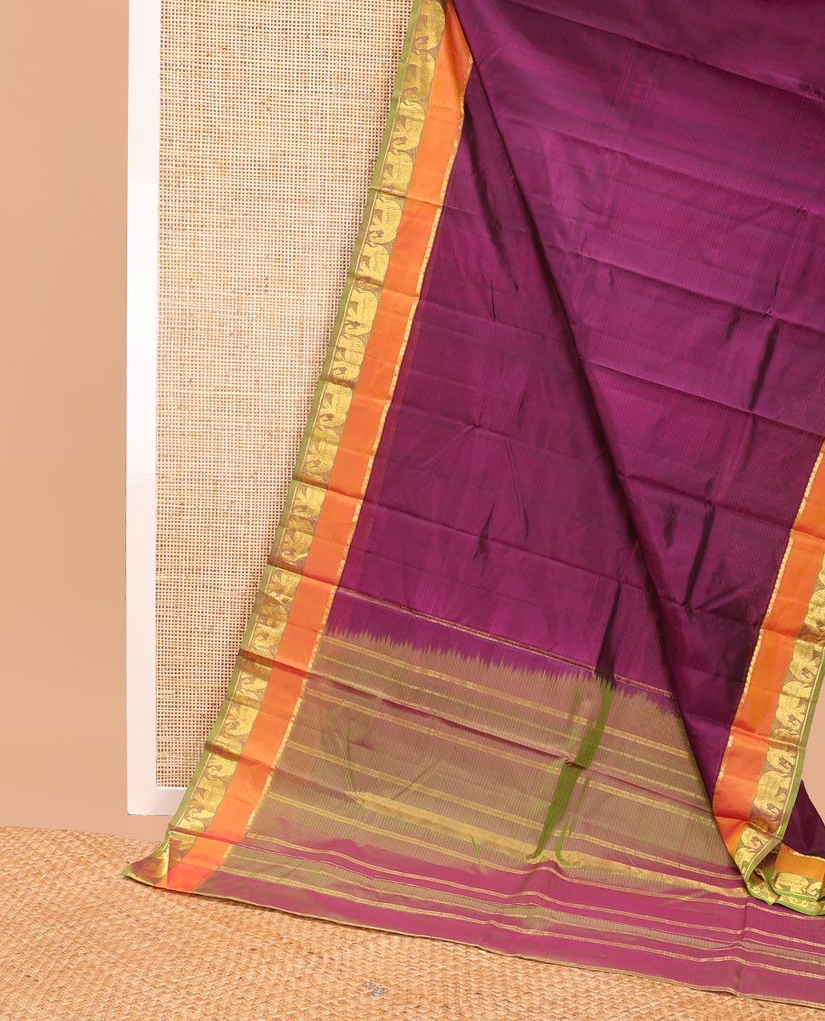Purple striped kancheepuram silk saree with contrast border of thilakam mokku, yanaai design & zari design pallu