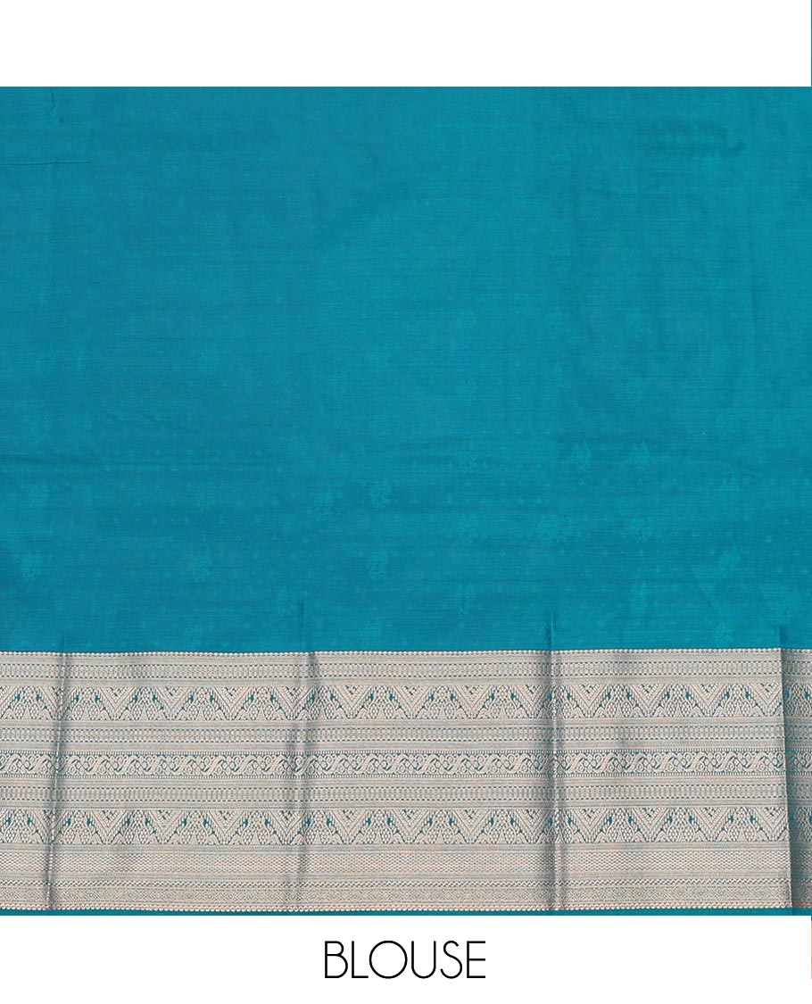 Blue Art Silk Pavadai Material Set, Finely Woven with Zari Buttas on Its Skirt, Highlighted by a Traditional Zari Design Border, and Paired with a Matching Blouse
