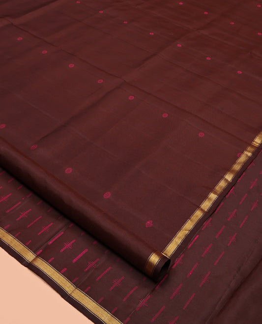 Brown Mayuri Soft Silk Saree, Subtly Woven with Buttas All Over Its Body, a Subtle Zari Piping Border, Pallu Steeped with Buttas, and Paired with a Matching Blouse