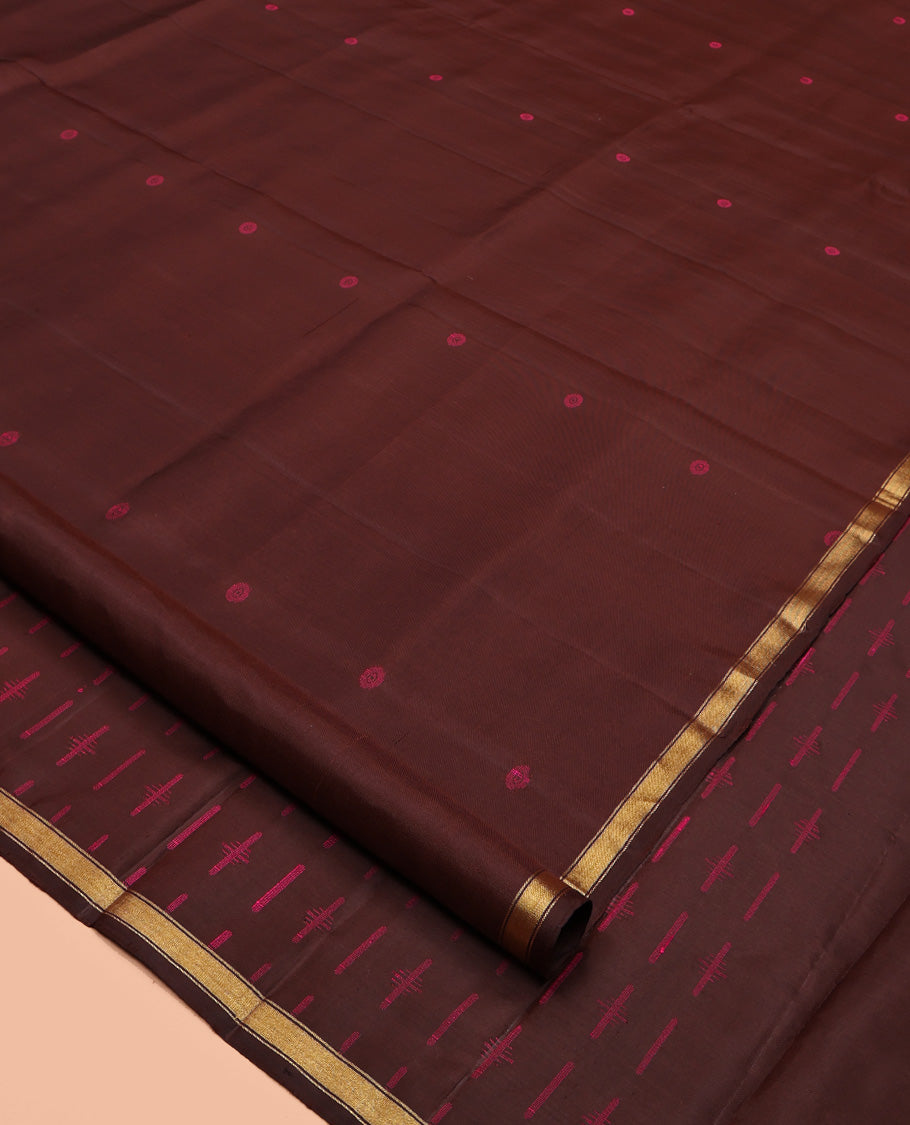 Brown Mayuri Soft Silk Saree, Subtly Woven with Buttas All Over Its Body, a Subtle Zari Piping Border, Pallu Steeped with Buttas, and Paired with a Matching Blouse