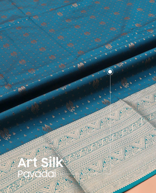Blue Art Silk Pavadai Material Set, Finely Woven with Zari Buttas on Its Skirt, Highlighted by a Traditional Zari Design Border, and Paired with a Matching Blouse