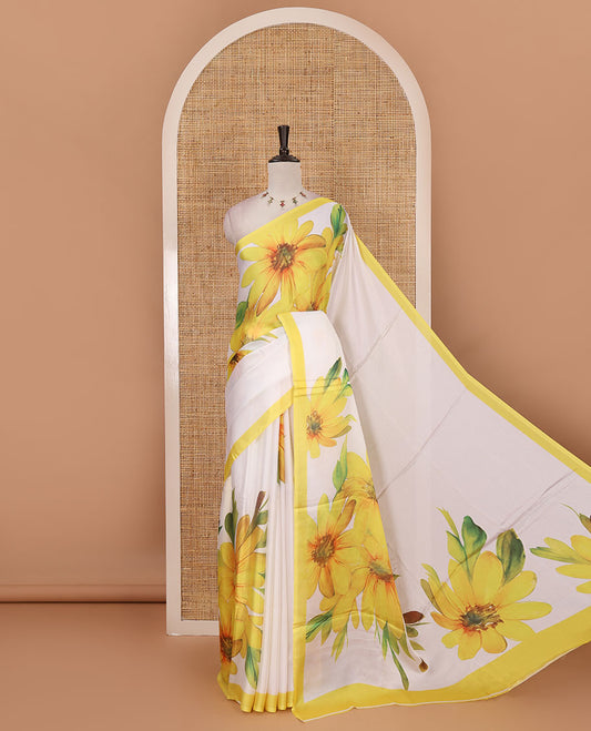 Cream base digital printed satin crepe saree with big yellow floral motifs all over the saree, plain yellow border & blouse