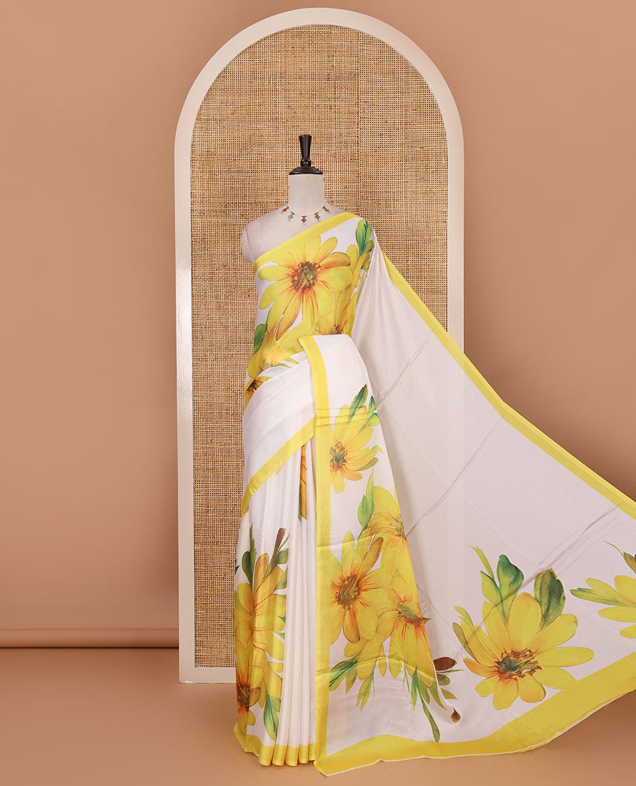 Cream base digital printed satin crepe saree with big yellow floral motifs all over the saree, plain yellow border & blouse