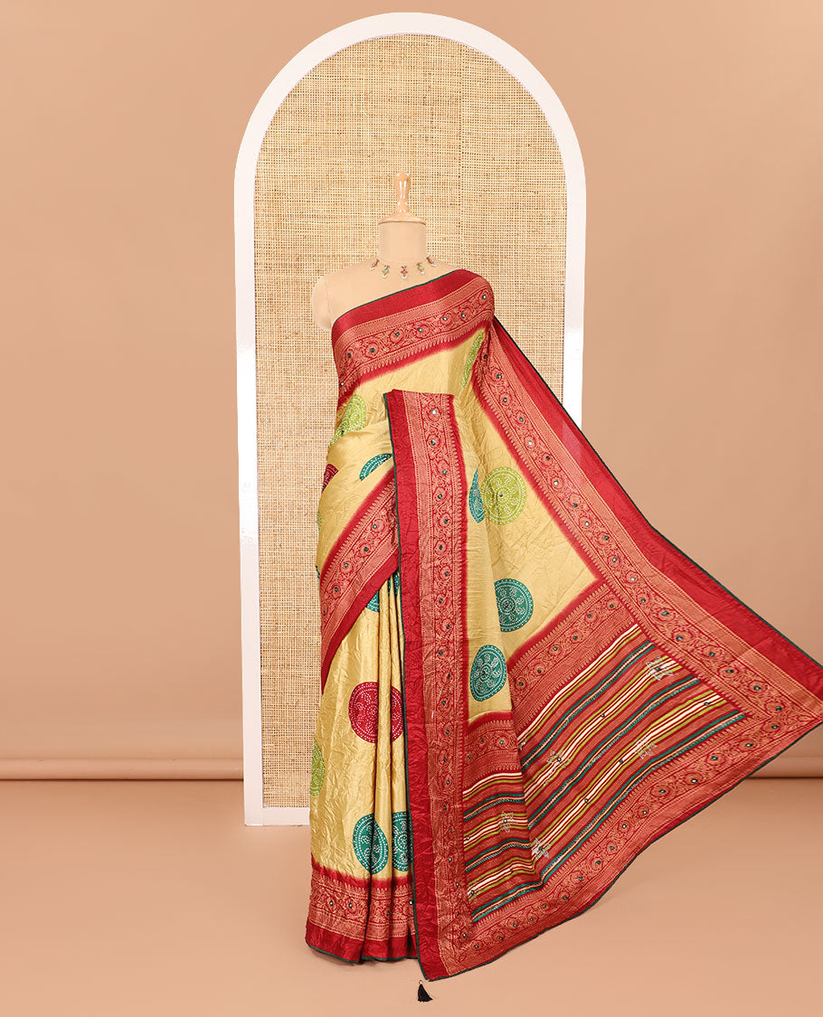 Gold bandhani printed with mirror work moss crepe saree, contrast traditional design mirror work border, printed pallu of Swarovski stone work, and a contrast plain blouse