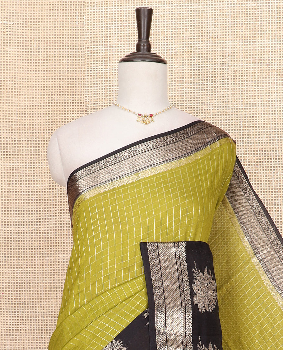 Green zari checked Assam silk saree, contrast traditional zari border of floral designs, and pallu of zari designs