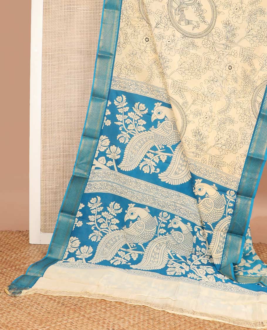 Light sandal kalamkari floral and peacock machine printed kalamkari cotton saree, contrast traditional zari border, and pallu of peacock print