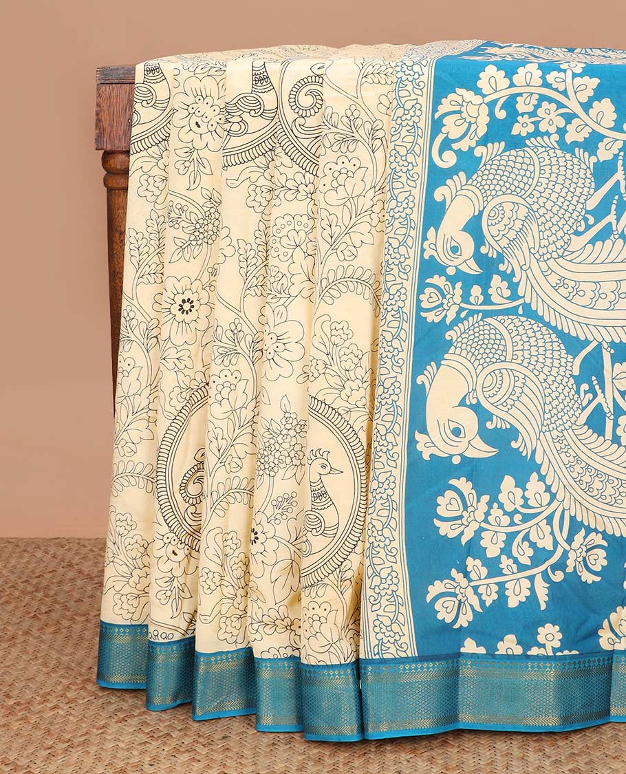 Light sandal kalamkari floral and peacock machine printed kalamkari cotton saree, contrast traditional zari border, and pallu of peacock print