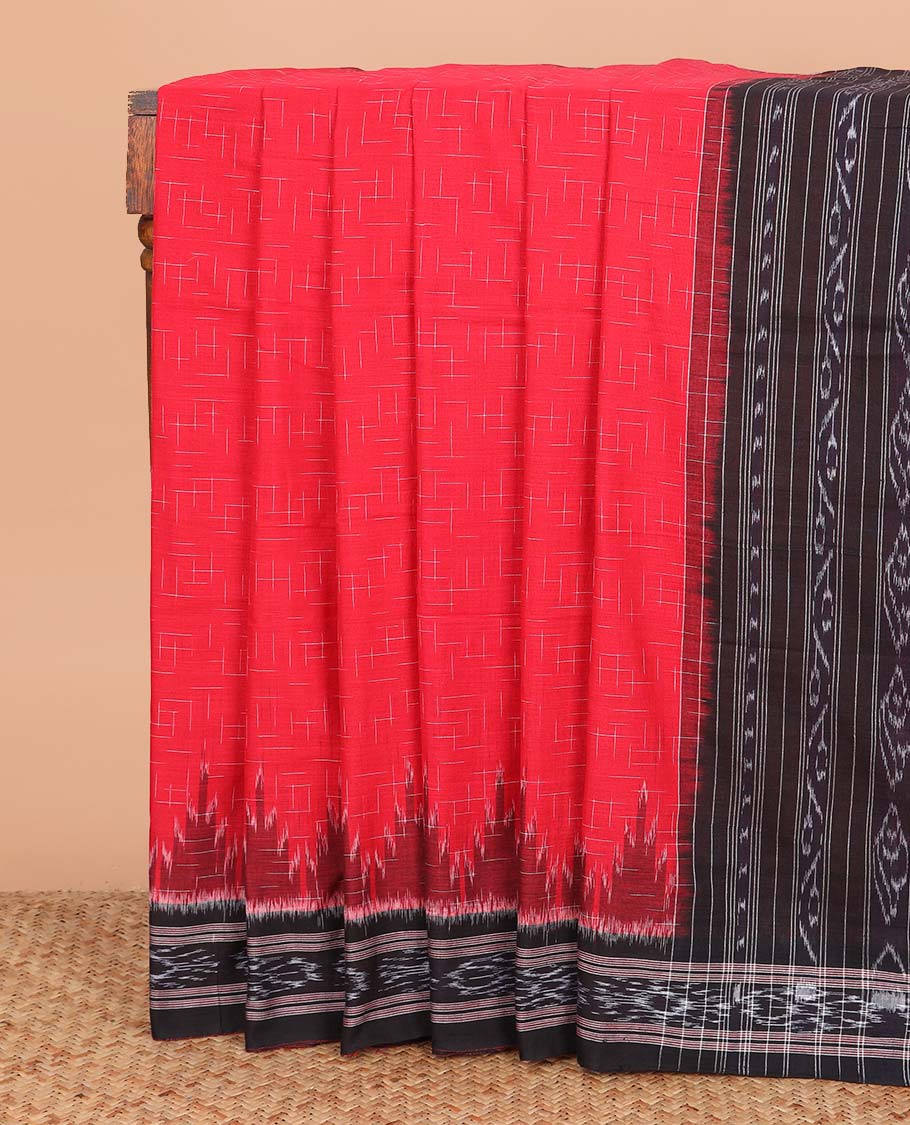 Red geometric maze style ikkat cotton saree, contrast black ikkat border, and pallu of ikkat weave