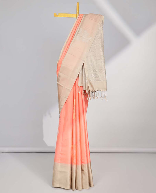 Peach floral buttas soft silk saree with contrast floral border & round buttas pallu