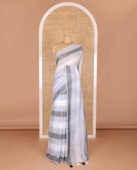 Grey ombre-colored striped khadi mul cotton saree, zari piping border, striped pallu, and a matching striped blouse