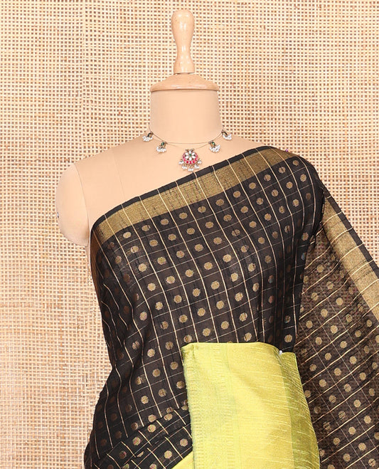 Black polka dot butta enclosed checked semi-raw silk saree, contrast traditional zari design border, contrast diamond patterned pallu, and a contrast blouse