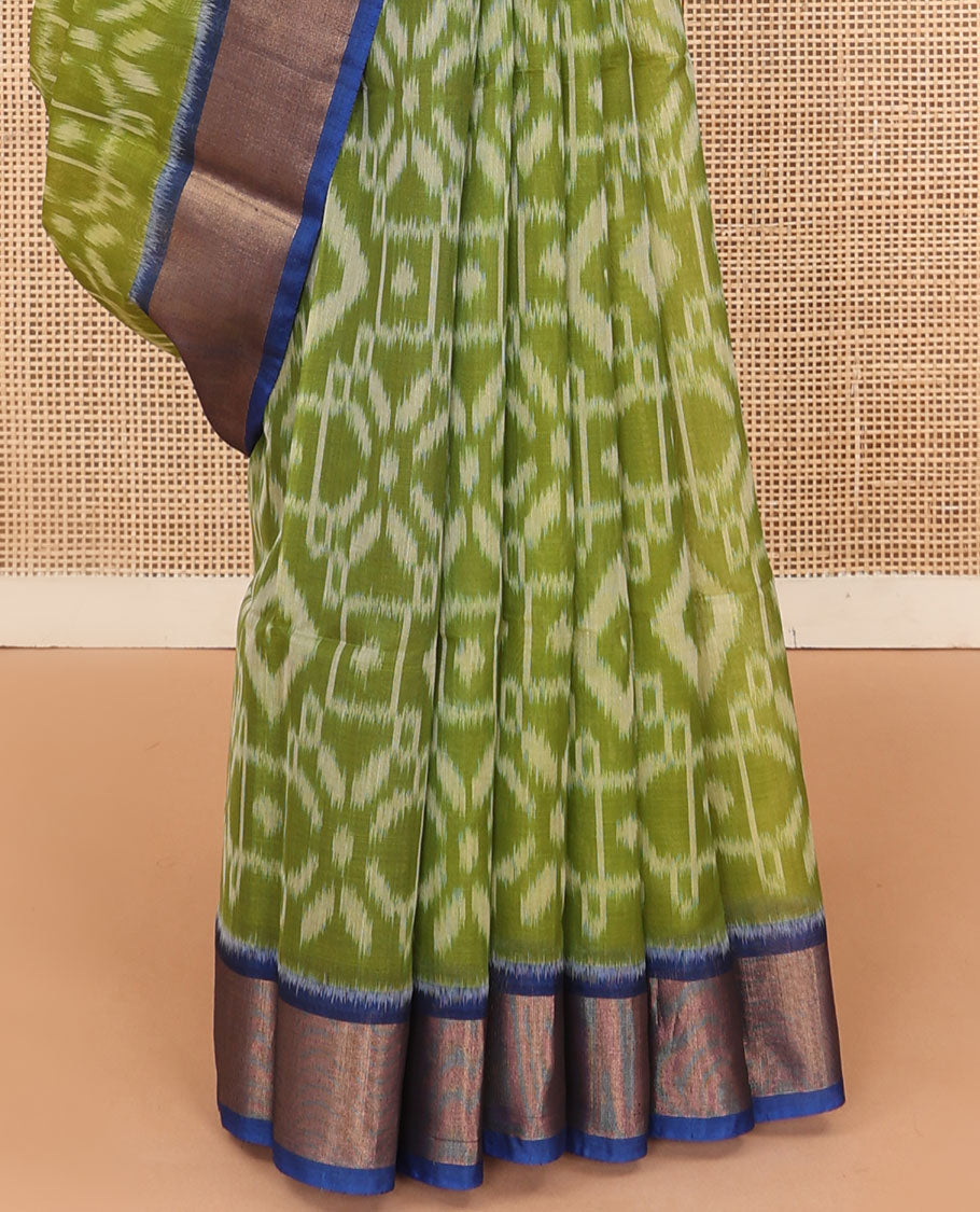 Green ikkat design silk cotton saree, contrast bavanji border, and pallu of ikkat designs