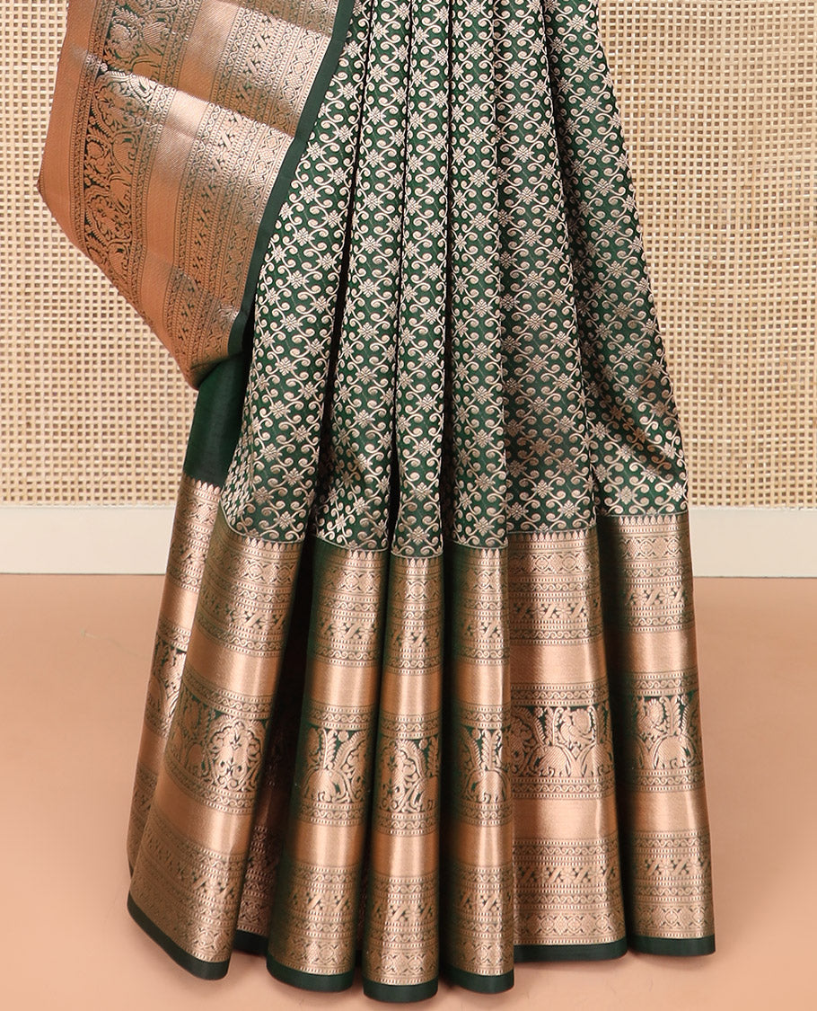 Green Kanchipuram Silk Saree Spotlighted with Jacquard Design, Highlighted by Zari Border of Thilakam, Diamond, Chakram, Cross Kamalam, Mayil, Yaanai, and Zari Designs, Pallu Pictures Big Yaali Designs, and Paired with a Matching Blouse