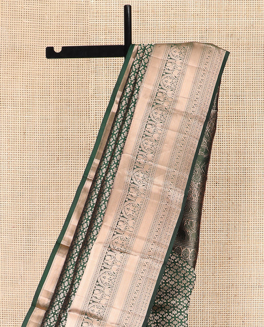 Green Kanchipuram Silk Saree Spotlighted with Jacquard Design, Highlighted by Zari Border of Thilakam, Diamond, Chakram, Cross Kamalam, Mayil, Yaanai, and Zari Designs, Pallu Pictures Big Yaali Designs, and Paired with a Matching Blouse