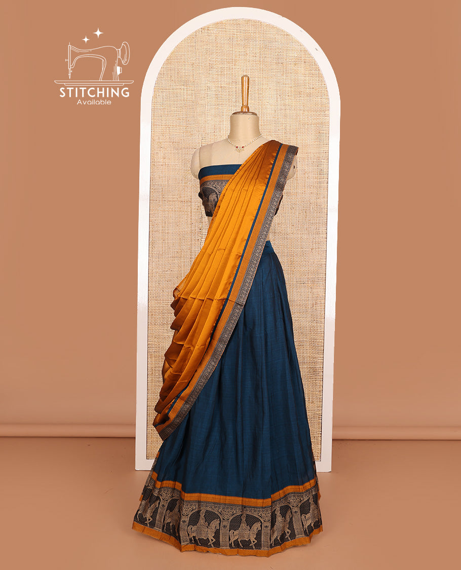 Peacock blue cotton half-saree, plain with contrast man on the horse motifs bordered skirt, matching blouse, and contrast dhavani