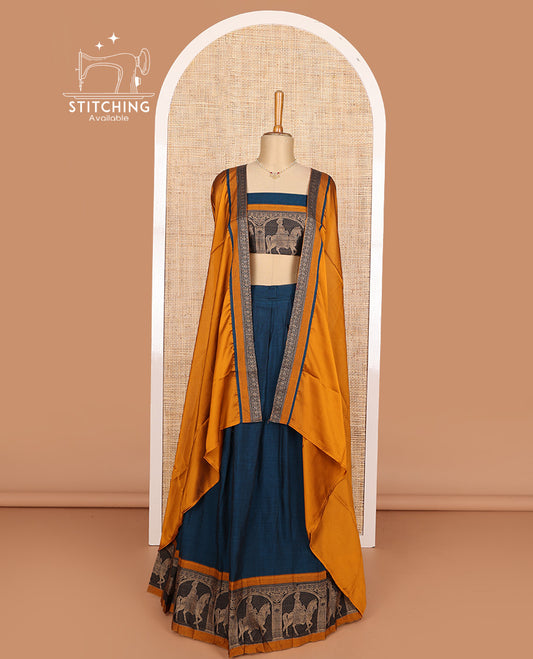 Peacock blue cotton half-saree, plain with contrast man on the horse motifs bordered skirt, matching blouse, and contrast dhavani