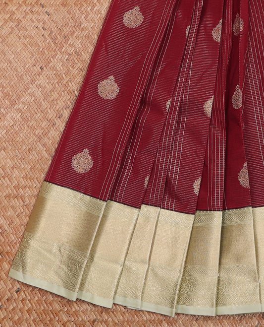 Maroon Budget Silk Saree Detailed with Zari Buttas and stripes, Complemented by a Contrast Traditional Zari Border, subtly decked up Pallu, and Paired with a Contrast Blouse
