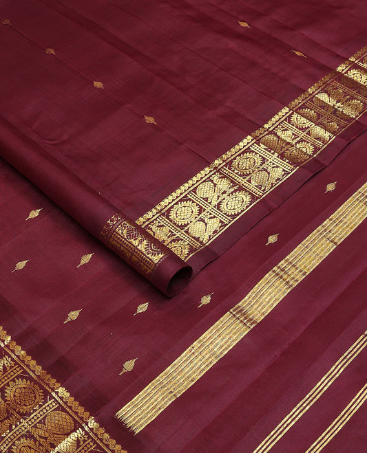 Maroon zari buttas Kanchipuram silksaree, one-sided border of salngai,banaras & annam chakram & zari design pallu