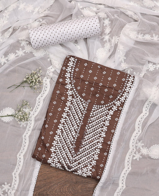Brown Material Chudidar Set, Adorned with Geometric Print and Neck Embroidery on Rayon Top, a Contrast Polka Dot Printed Bottom, and Paired with Embroidered Chiffon Dupatta