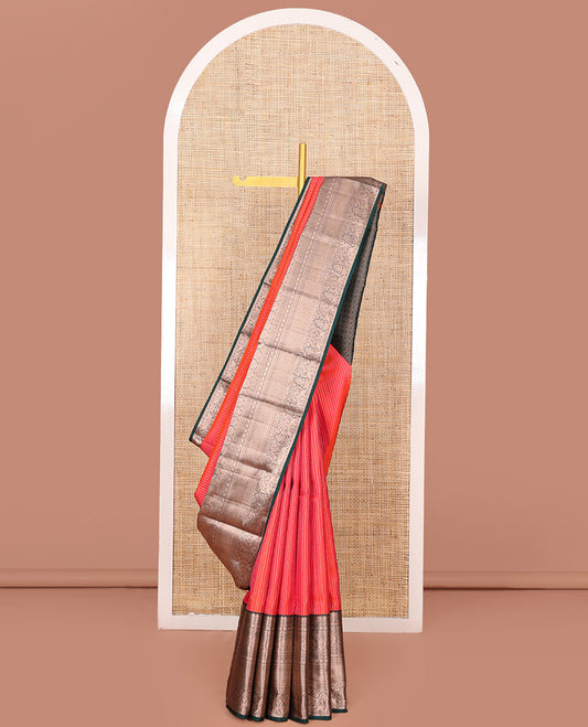 Orange Vasundhara Silk Saree Gracefully Embellished with Dobby-Style Zari Buttas, Highlighted by a Contrast Border of Rekku, Kathir, Cross Kamalam, Chakram, Mayil Kann, Mayil, and Yaanai, Scintillating Jaal Pallu, and Paired with a Contrast Blouse