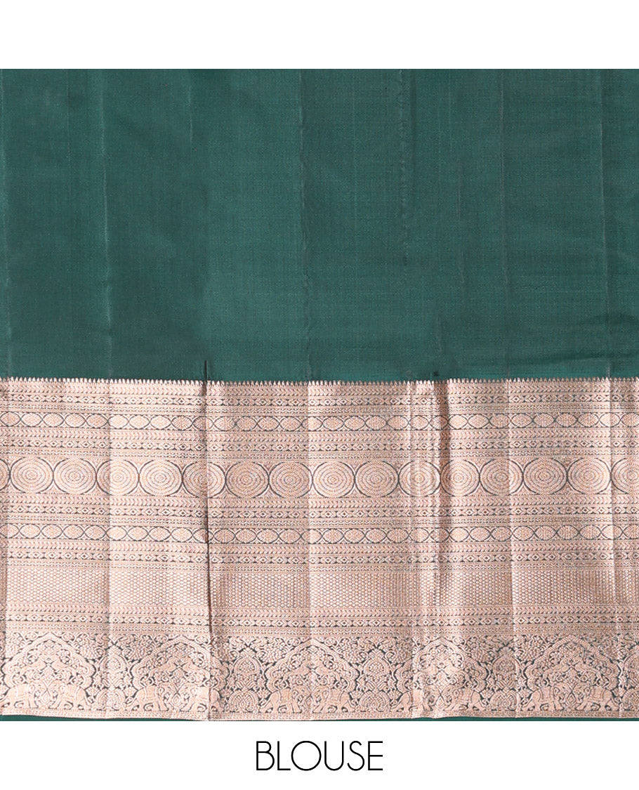 Orange Vasundhara Silk Saree Gracefully Embellished with Dobby-Style Zari Buttas, Highlighted by a Contrast Border of Rekku, Kathir, Cross Kamalam, Chakram, Mayil Kann, Mayil, and Yaanai, Scintillating Jaal Pallu, and Paired with a Contrast Blouse