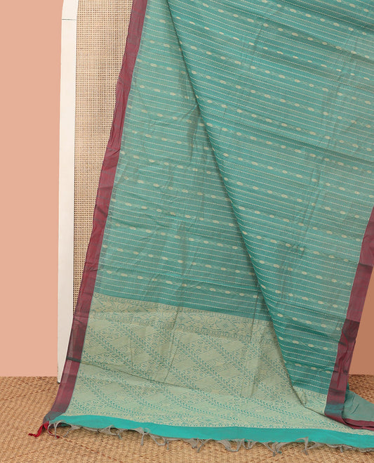 Green Kanchi Cotton Saree, Graced with Thread Stripes All Over Its Body, Complemented by Contrast Border, Pallu Featuring Geometric Designs, and Paired with a Matching Blouse