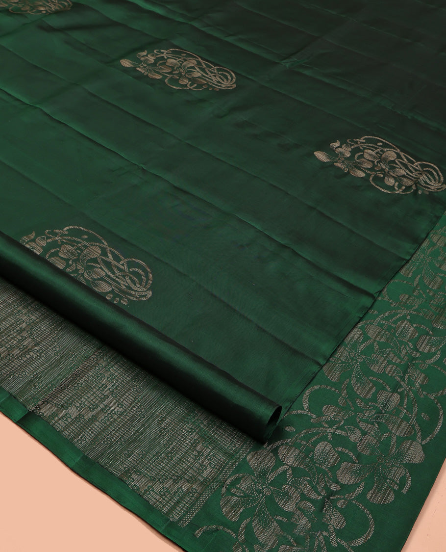 Borderless Green Mayuri Soft Silk Saree, Elevated with Buttas All Over Its Body, a Sparsely Sparkled Self-Pallu, and Paired with a Matching Blouse