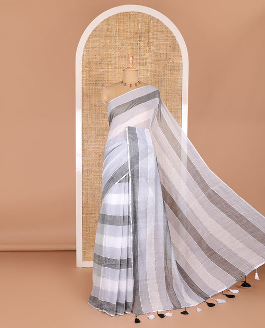 Grey ombre-colored striped khadi mul cotton saree, zari piping border, striped pallu, and a matching striped blouse