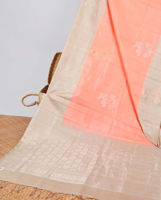 Peach floral buttas soft silk saree with contrast floral border & round buttas pallu