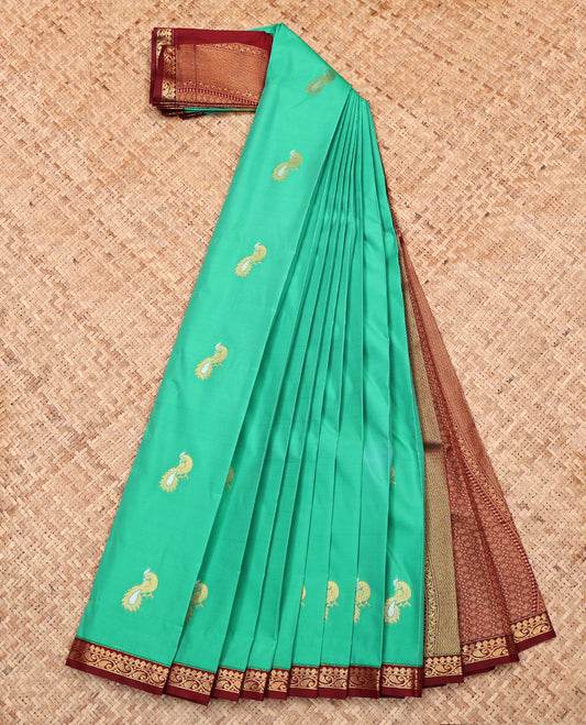 Green Budget Silk Saree, Mesmerized with Peacock Buttas, Complemented by a Contrast Paisley Vine Zari Border, Grand Pallu, and Contrast Blouse