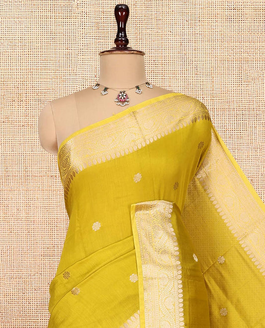 Green Assam Silk Saree, Delicately Woven with Zari Buttas, Highlighted by a Zari Floral Creeper Woven Border, Zari-Striped Pallu, and a Matching Blouse
