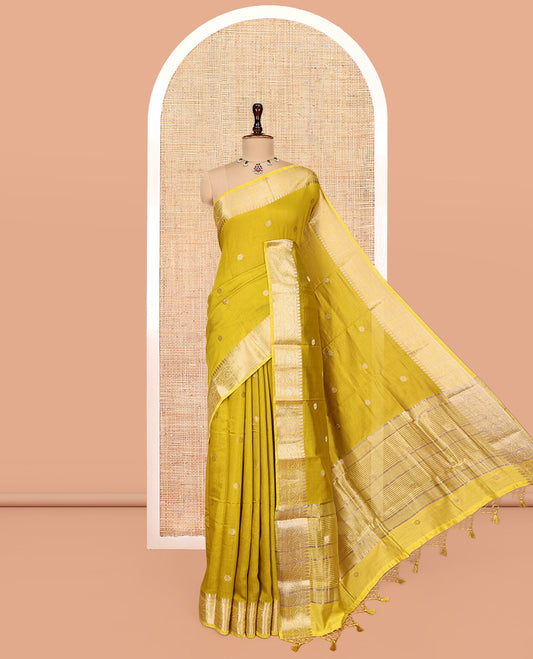 Green Assam Silk Saree, Delicately Woven with Zari Buttas, Highlighted by a Zari Floral Creeper Woven Border, Zari-Striped Pallu, and a Matching Blouse